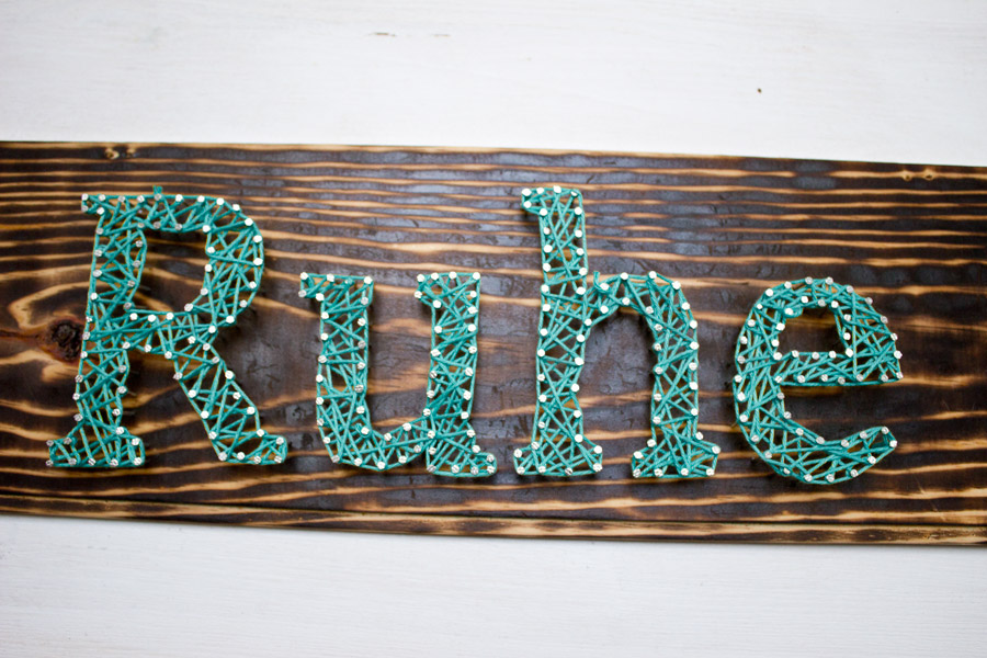 Make yourself a typography inspired DIY string art sign with just a few easy steps.