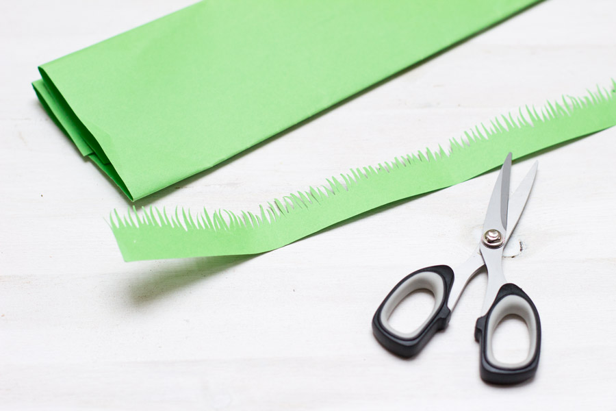 cutting grass out of green paper