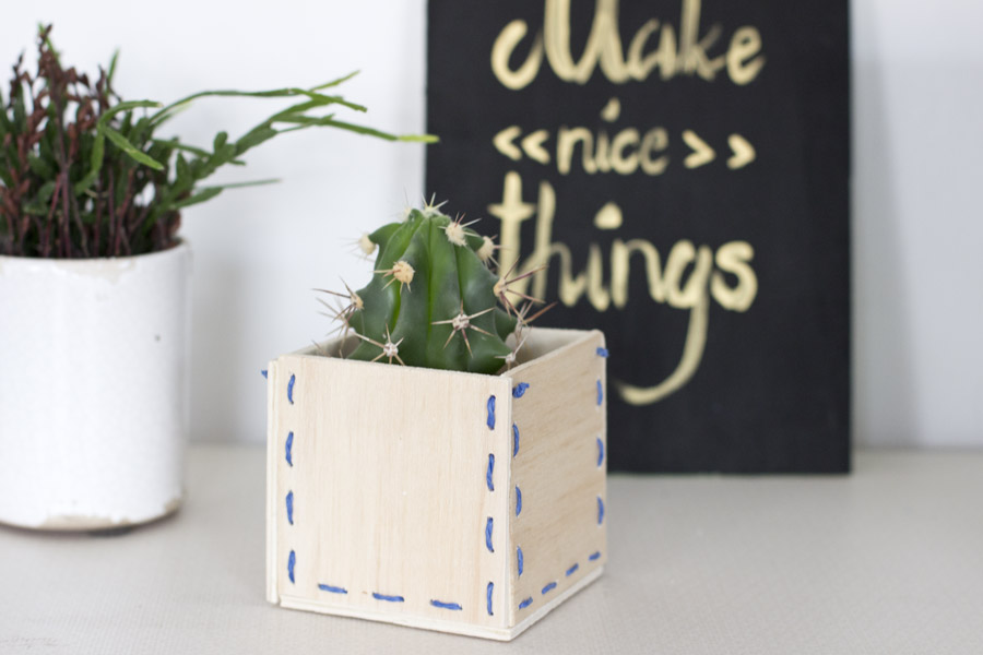 Make a special kind of pot for your plants with this wooden stitched planter DIY.