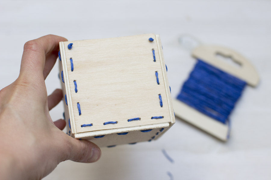 Make a special kind of pot for your plants with this wooden stitched planter DIY.