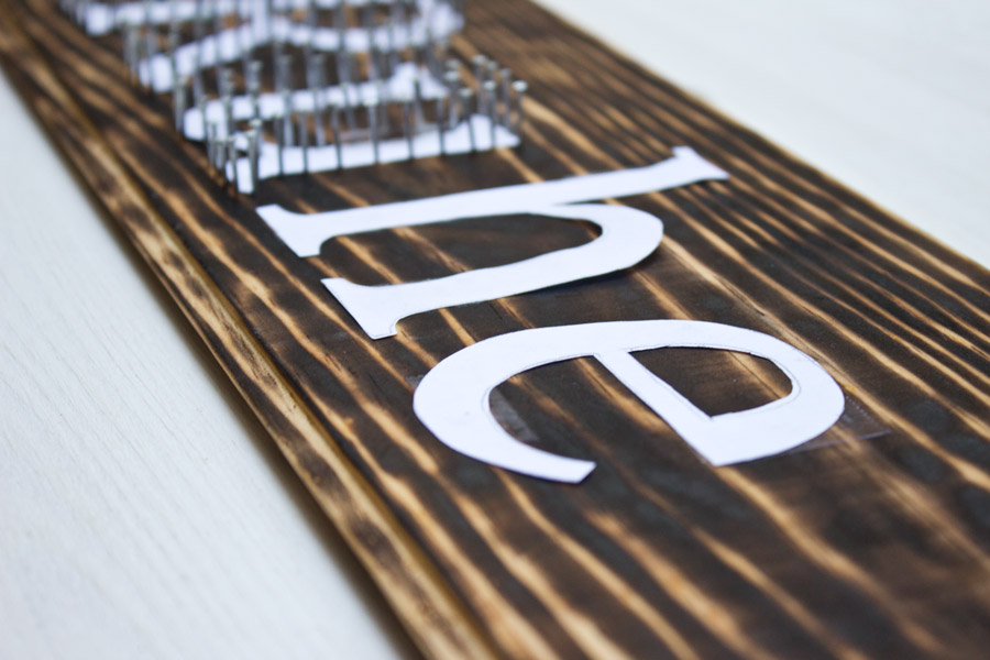 How to make yourself a typography inspired DIY string art sign with just a few easy steps.