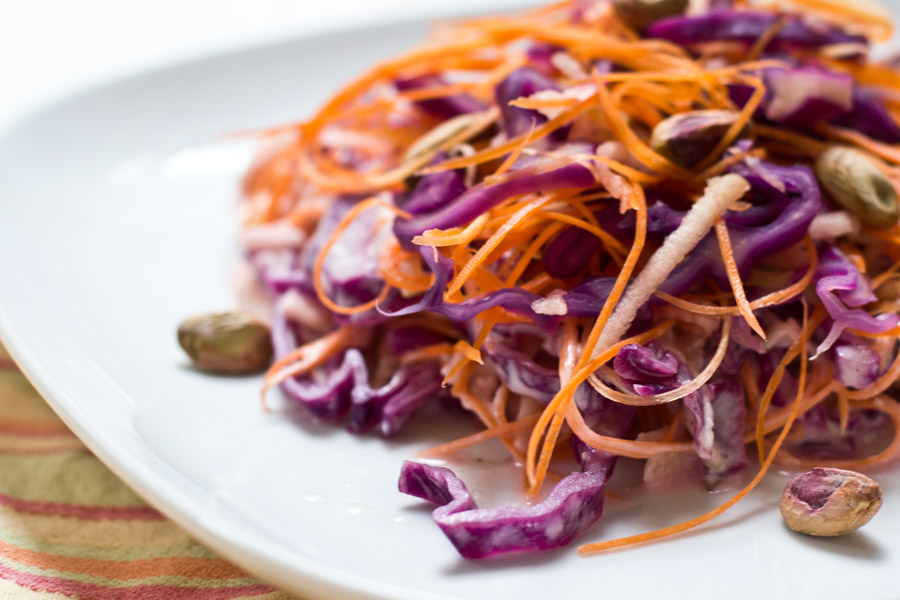 Red cabbage salad with apple, carrot and pistachio