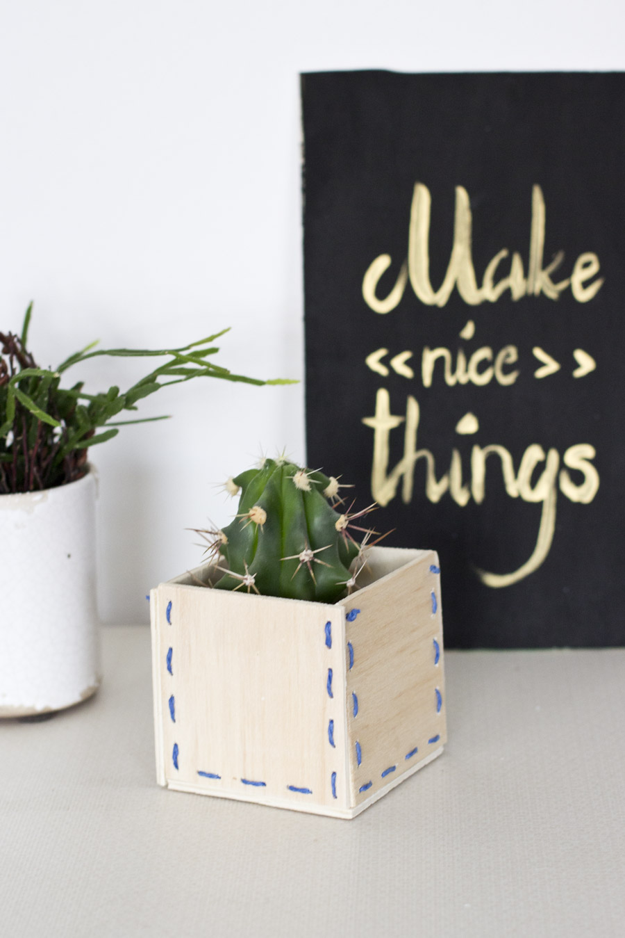 Make a special kind of pot for your plants with this wooden stitched planter DIY.